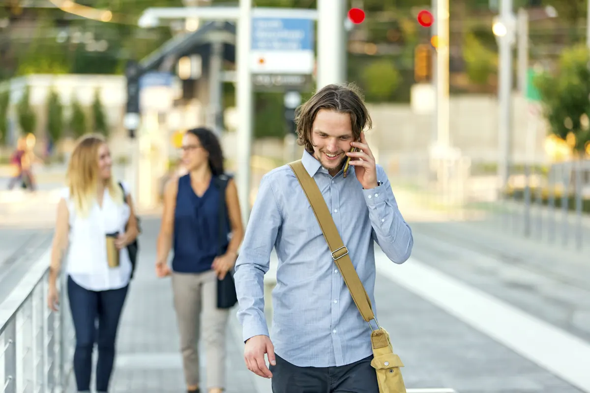 Good news Man walking downtown getting good news